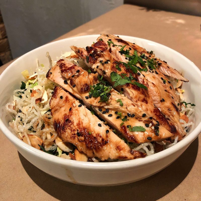 Chinese Chicken Salad (shredded romaine, iceberg and Napa cabbage, crispy rice noodles, toasted almonds, sesame seeds, Hoisin BBQ chicken with sesame-rice wine)