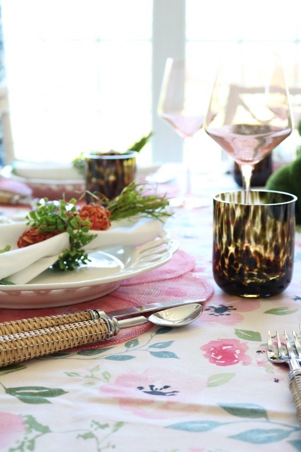 A tortoise low ball glass adds neutrality to a colorful Easter brunch table.