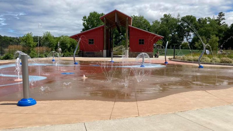 https://www.scoopcharlotte.com/wp-content/uploads/2023/07/Clarks-Creek-Park-splashpad-800x450.jpeg